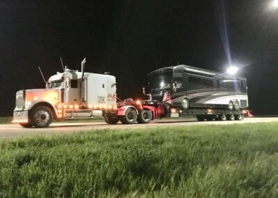freightliner tow truck pulling RV