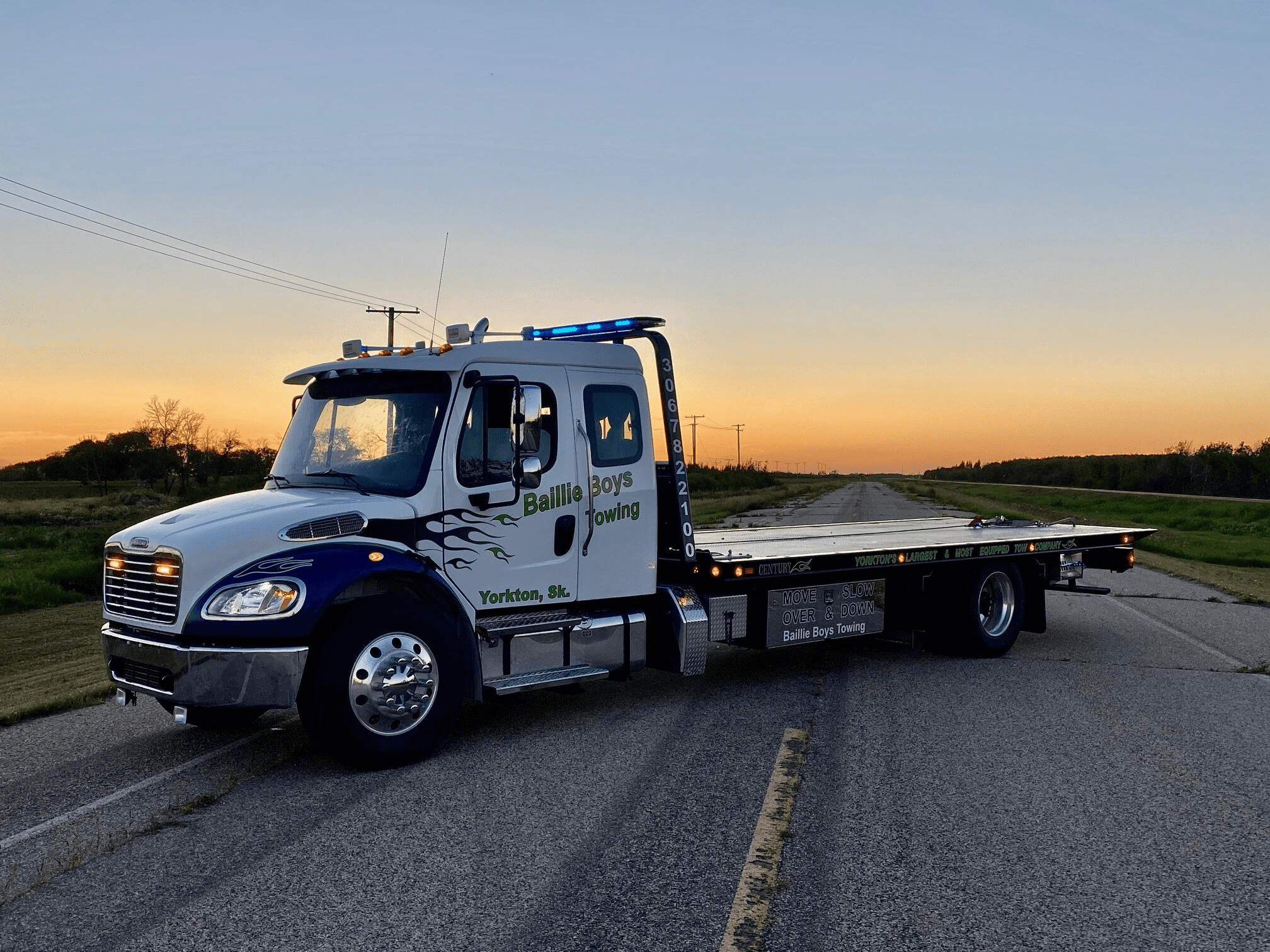 freightliner with century towing recovery flat deck